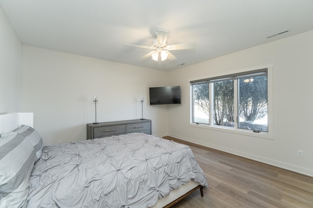 bedroom featuring ceiling fan and light hardwood / wood-style floors