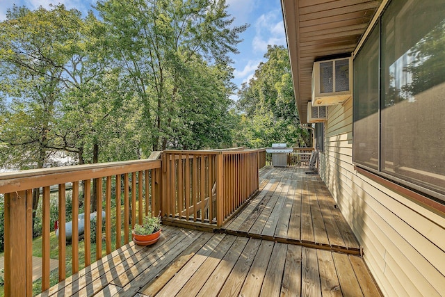 wooden deck with a grill