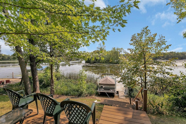 deck with a dock and a water view