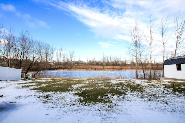 view of yard covered in snow