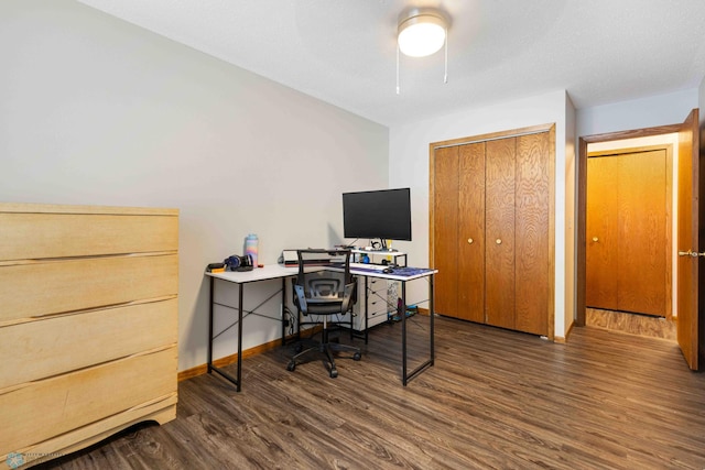 office space with dark wood-type flooring