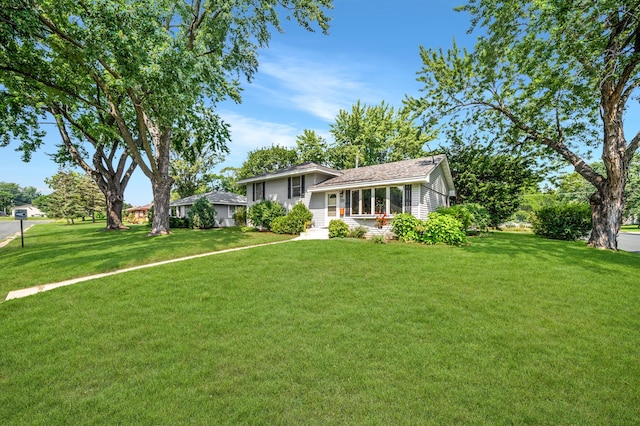 split level home with a porch and a front yard