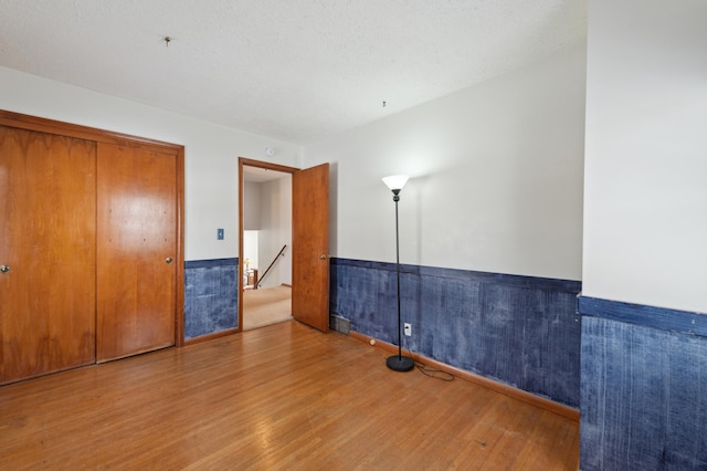 unfurnished room featuring hardwood / wood-style flooring