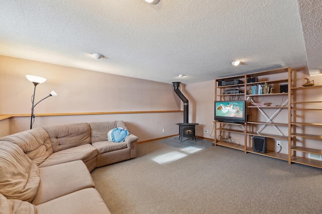 carpeted living room with a textured ceiling and a wood stove