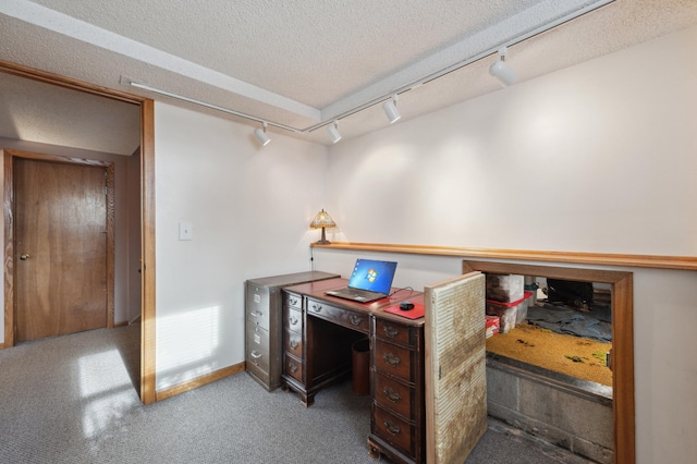 office featuring carpet flooring and a textured ceiling