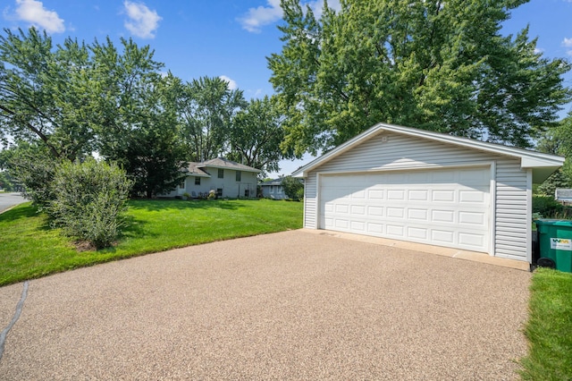 garage featuring a lawn