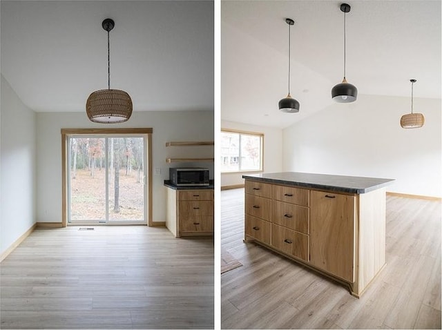 kitchen featuring light hardwood / wood-style flooring, pendant lighting, and vaulted ceiling