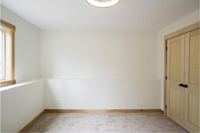 empty room featuring light carpet