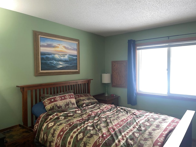 bedroom featuring a textured ceiling