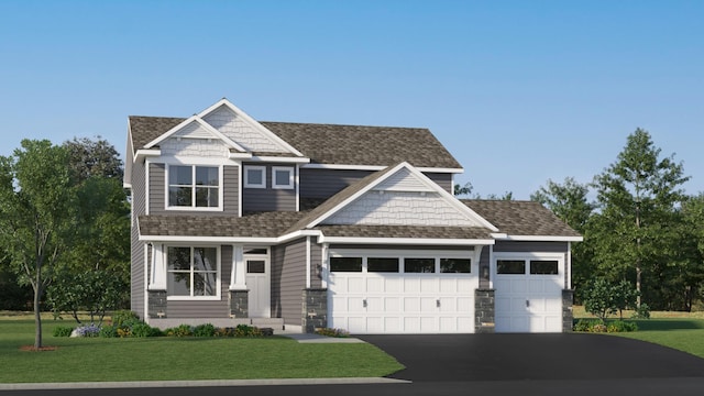 craftsman house featuring a garage and a front lawn