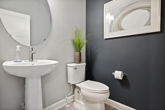 bathroom featuring sink and toilet