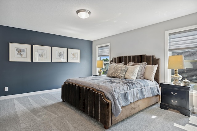 bedroom featuring light carpet