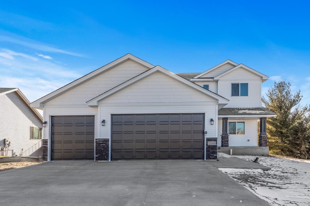 craftsman-style home with a garage