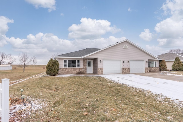 ranch-style home with a garage and a front lawn