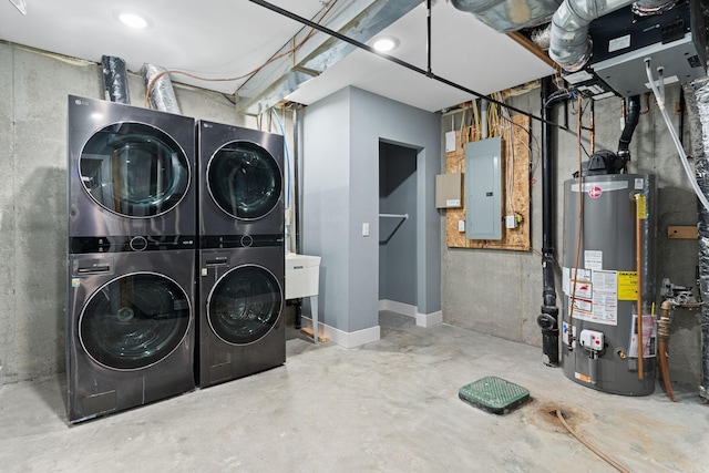 clothes washing area with stacked washer / dryer, electric panel, and water heater