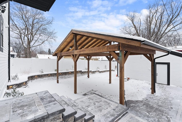 snow covered patio with a gazebo