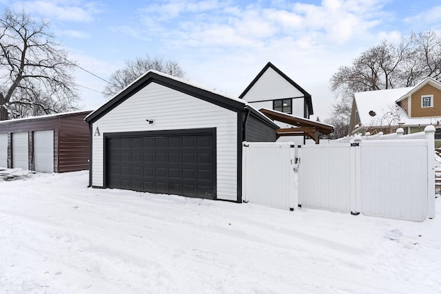 view of snow covered garage