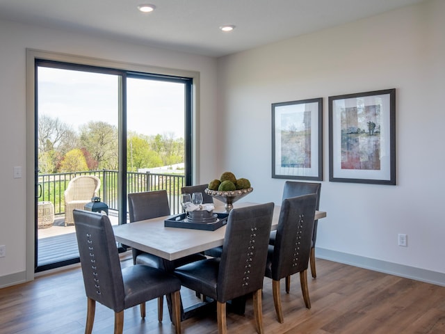 dining area with wood-type flooring