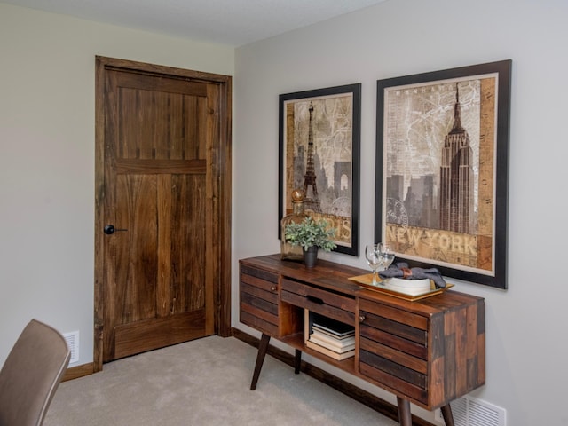 interior space featuring light colored carpet