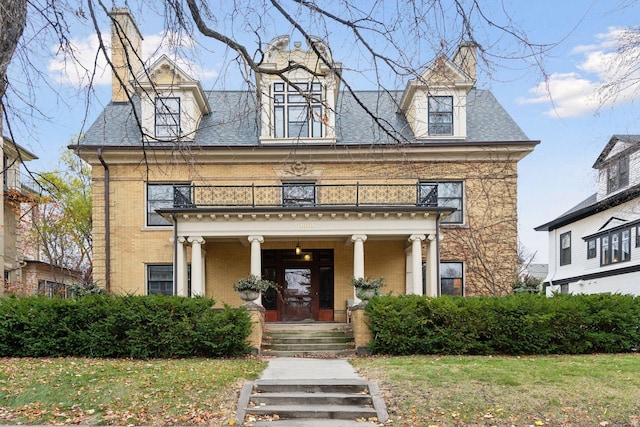 view of front of house with a balcony