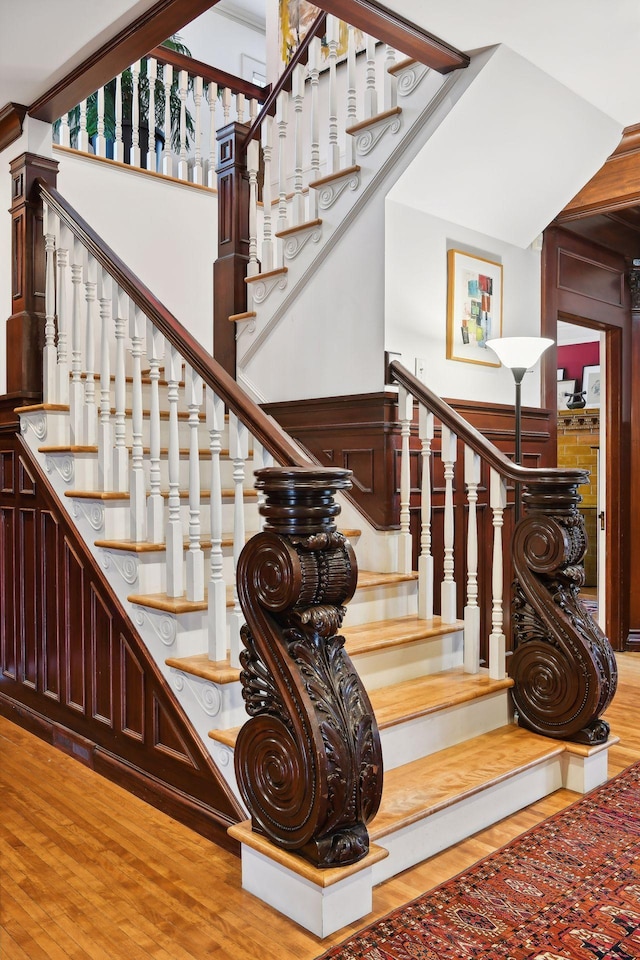 stairs featuring wood-type flooring