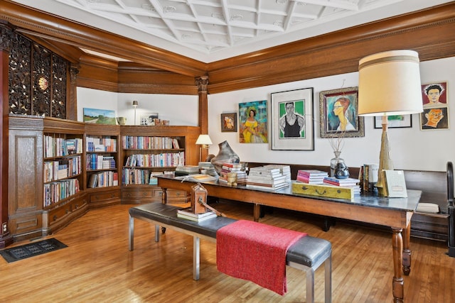 home office with beamed ceiling, hardwood / wood-style floors, and coffered ceiling