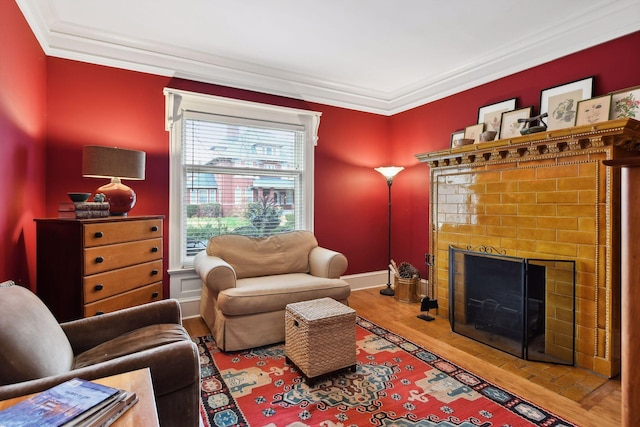 sitting room with hardwood / wood-style flooring, a fireplace, and a wealth of natural light