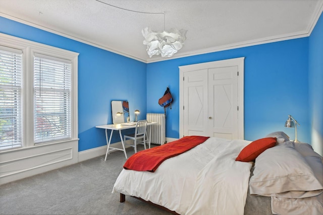 carpeted bedroom featuring a textured ceiling, crown molding, a chandelier, radiator heating unit, and a closet