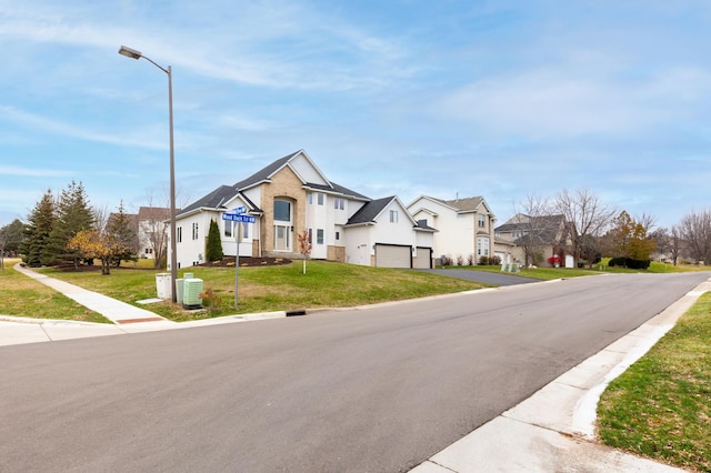 view of front of house featuring central AC unit and a front yard