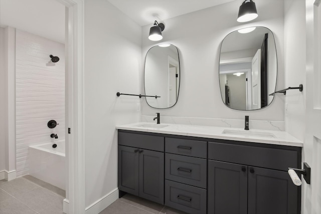 bathroom featuring tile patterned floors, vanity, and tiled shower / bath combo