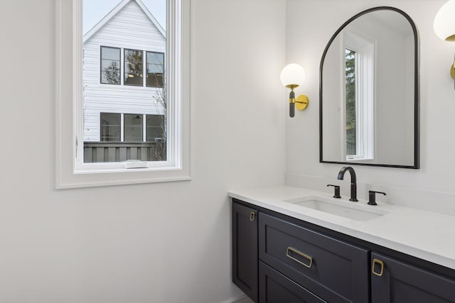 bathroom featuring vanity and a healthy amount of sunlight