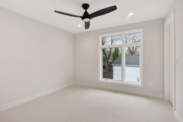 carpeted empty room with ceiling fan