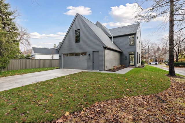 view of front of house featuring a front yard and a garage