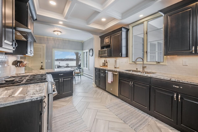 kitchen featuring a sink, appliances with stainless steel finishes, crown molding, wall chimney range hood, and light stone countertops