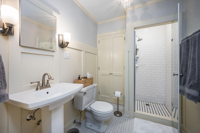 full bath featuring tile patterned flooring, a shower stall, toilet, and ornamental molding