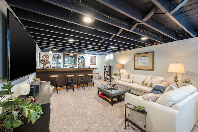 carpeted living room with a dry bar