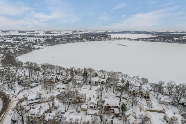 snowy aerial view featuring a residential view