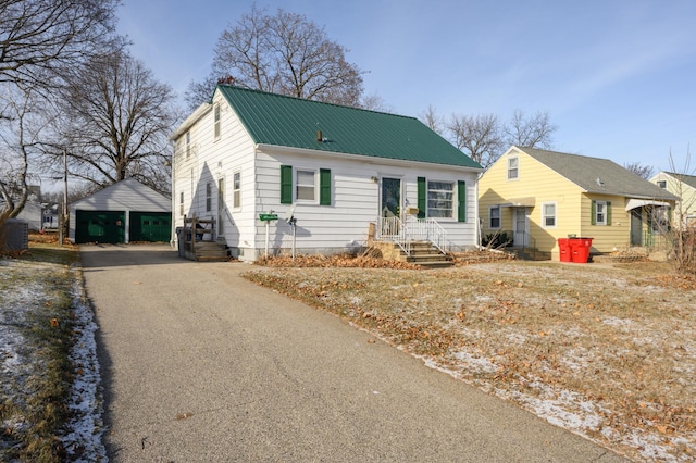 view of front of property featuring an outbuilding and a garage