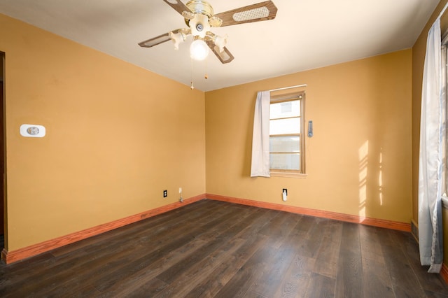 unfurnished room featuring ceiling fan and dark wood-type flooring