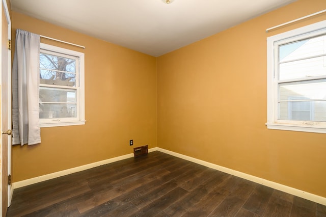 laundry room featuring dark wood-type flooring