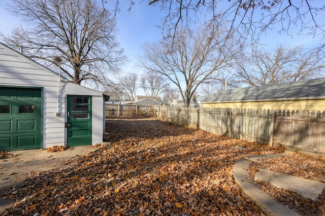 view of yard with a garage and an outdoor structure