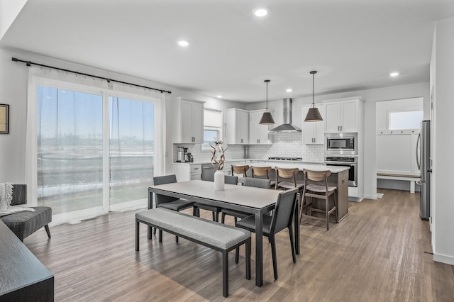 dining area with light hardwood / wood-style flooring