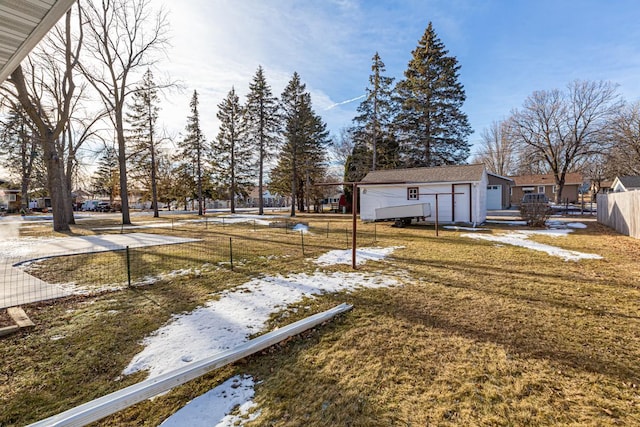 view of yard featuring an outbuilding and a garage