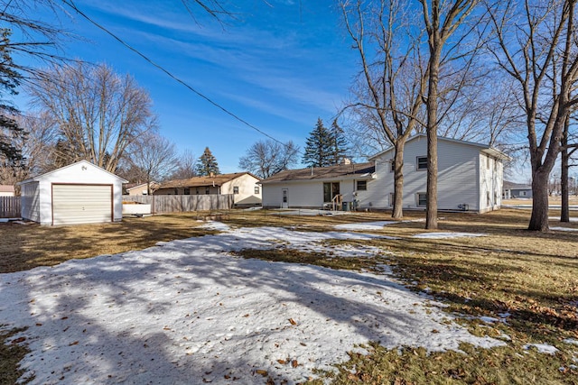 exterior space with an outbuilding and a garage