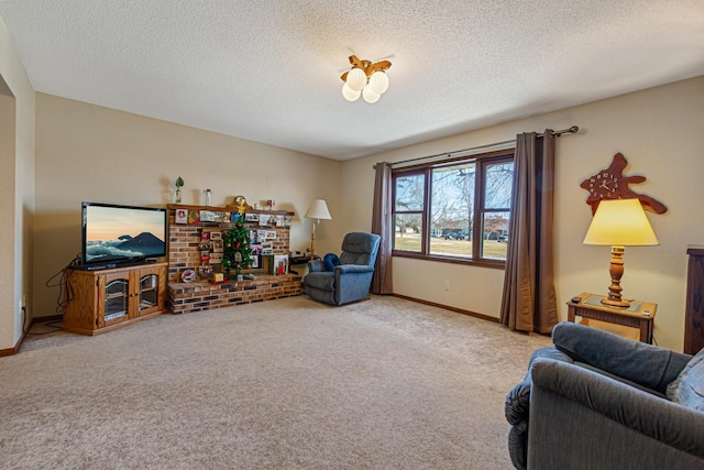 living area featuring carpet flooring and a textured ceiling