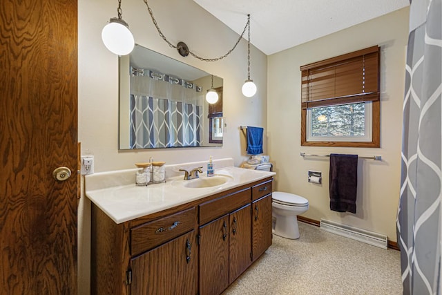 bathroom with vanity, a textured ceiling, and toilet