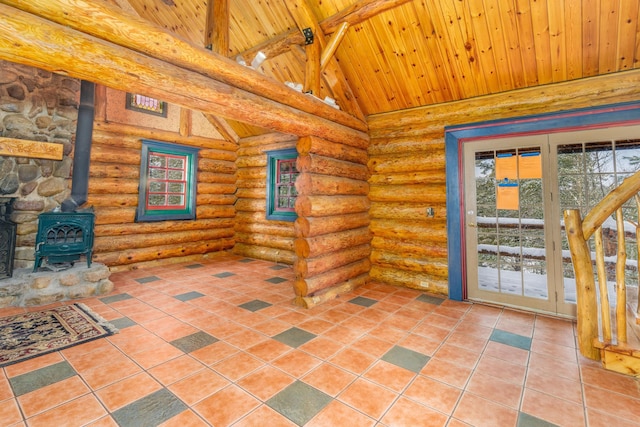 interior space with beam ceiling, a wood stove, log walls, wooden ceiling, and high vaulted ceiling