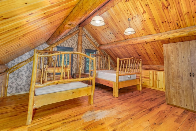 unfurnished bedroom featuring wood-type flooring, vaulted ceiling with beams, and wood ceiling