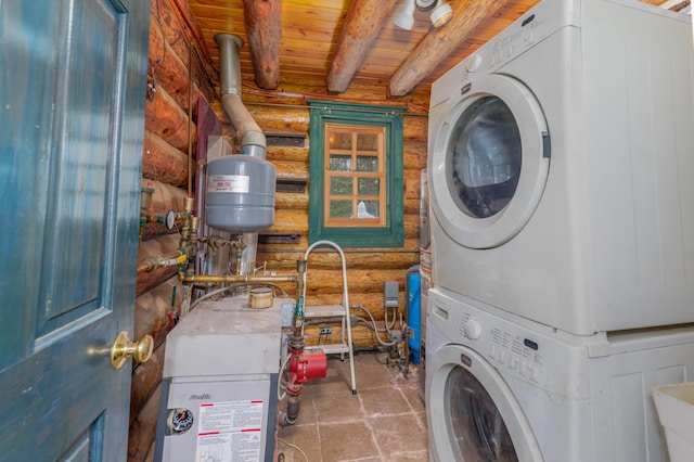 washroom with rustic walls, wood ceiling, and stacked washer / dryer