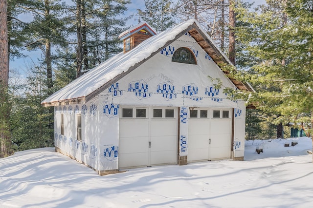 view of snow covered garage